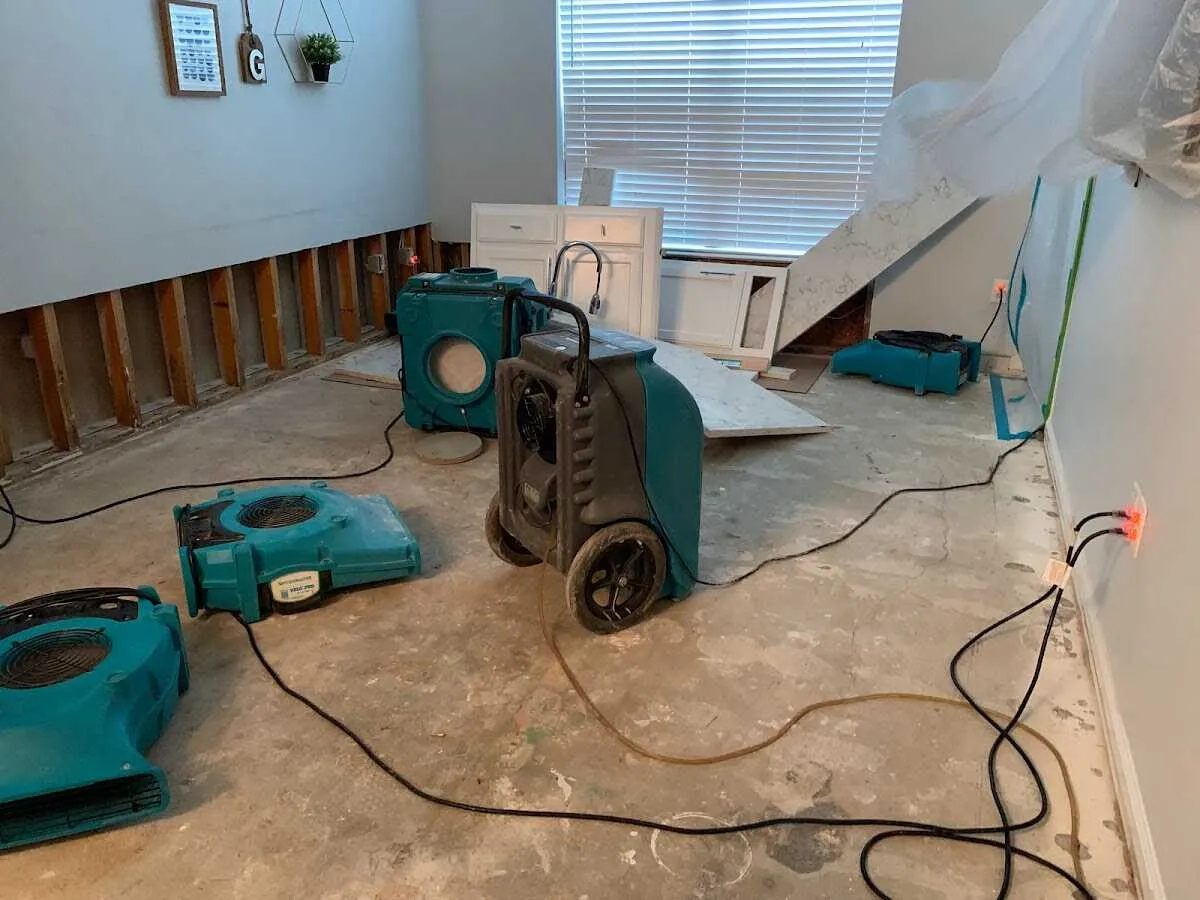 Dehumidifier in flood-cut room for Water Damage Restoration in West Des Moines
